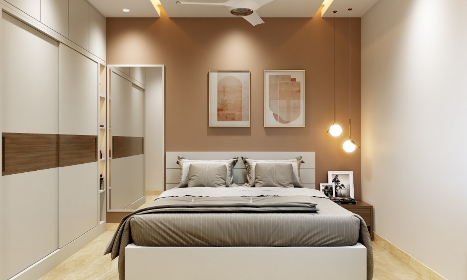 1bhk bedroom is designed with a king-sized bed and sliding wardrobe