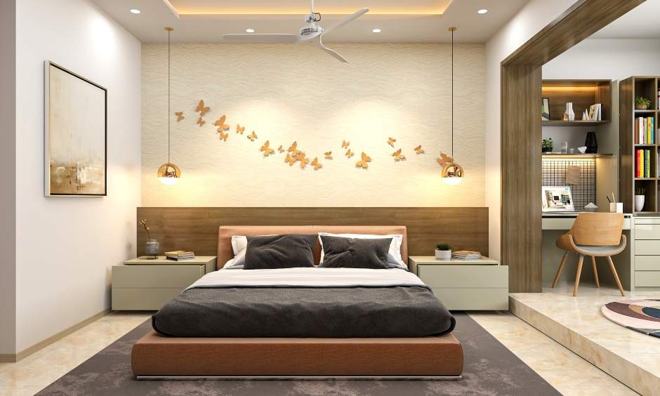 2bhk interior design master bedroom is designed with a platform bed with side tables on either side
