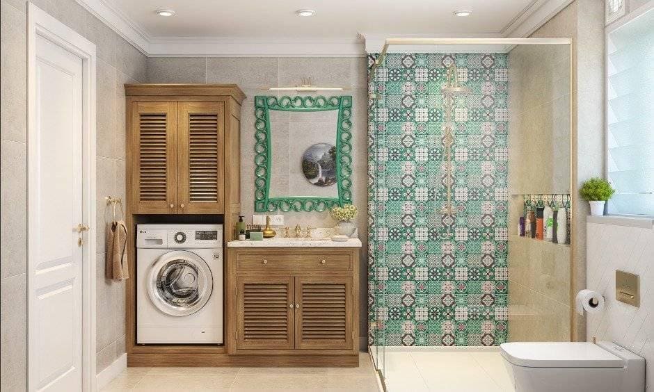 Creamy colour bathroom with wooden vanity unit with a washing machine cabinet is 3bhk interior design.