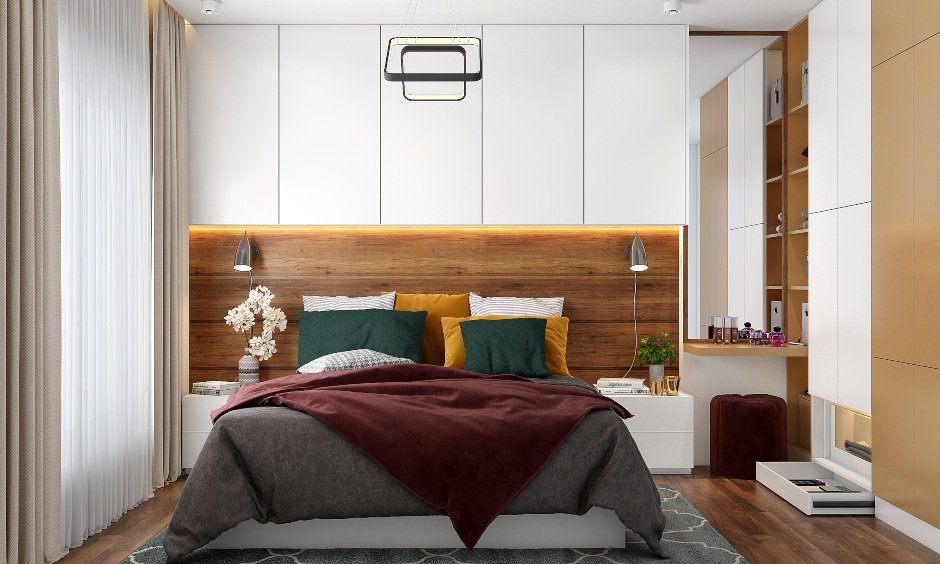A floor-to-ceiling wardrobe, open shelves and a dresser unit in a 3bhk duplex interior design