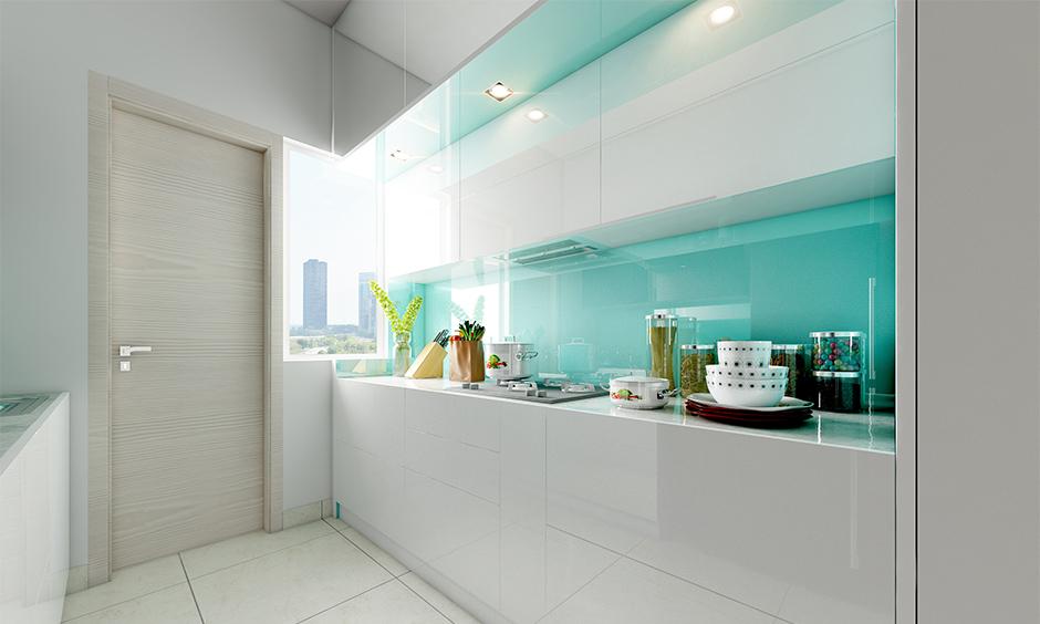 Contemporary back-painted glass kitchen with glossy surfaces and stylish layout
