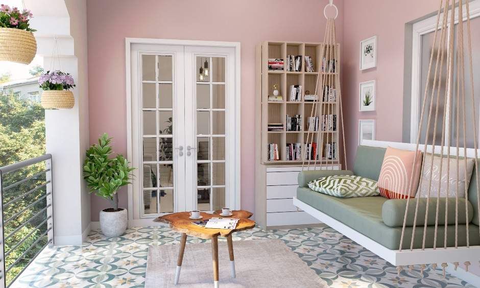 Balcony interior design with wooden two-seater jhula annd cushions and bolsters for ultimate comfort