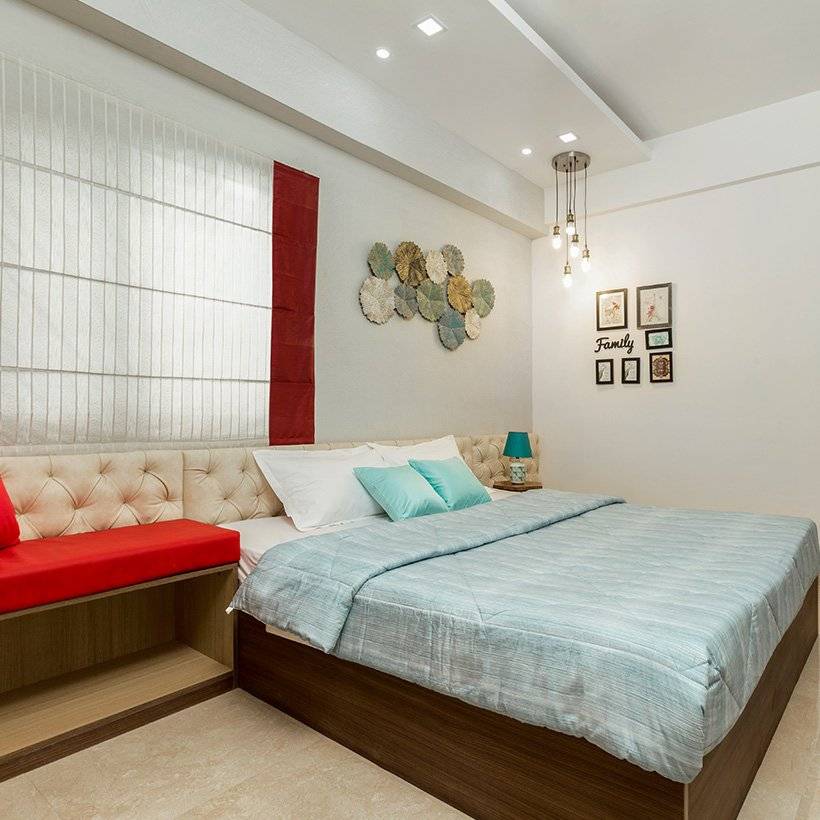 Bedroom wall design by putting up rosette flowers on bedroom wall its look like a modern bedroom wall design