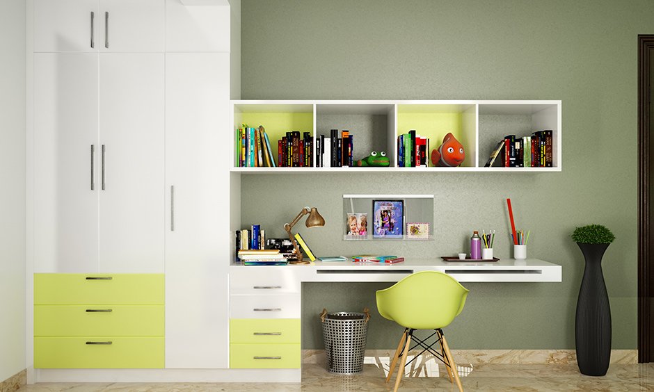Yellow & white study tables with wall mounted bookshelves are great options for book storage for a kids room.