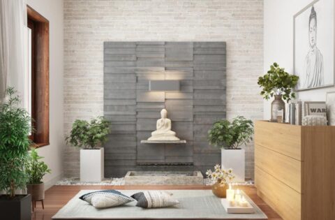 Neutral-toned meditation room with indoor plants and a Buddha statue for home Vastu