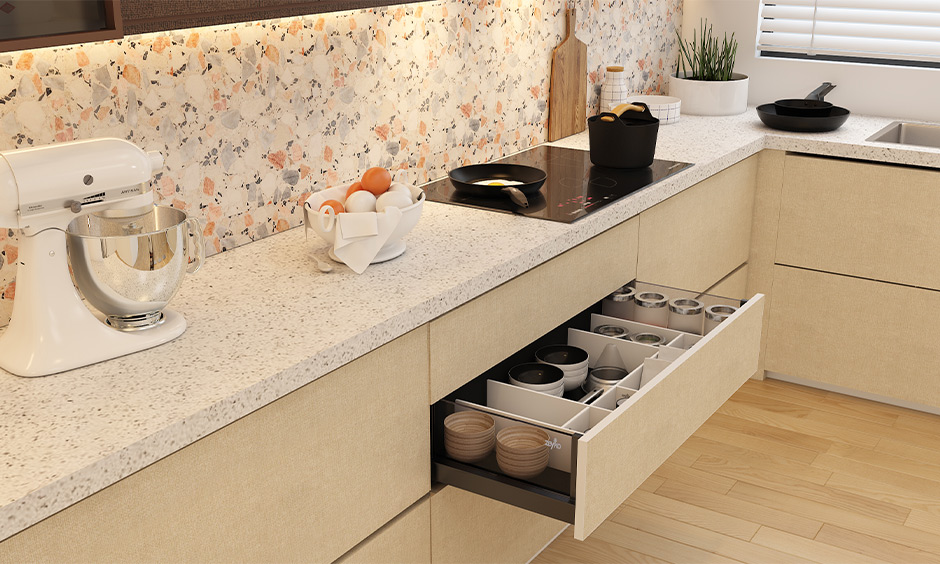 Quartz countertops in white and cream provide a durable and elegant option for a classic kitchen.
