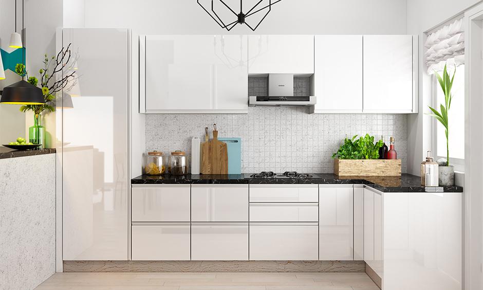 Modern back-painted glass kitchen design with glossy cabinets and sleek backsplash