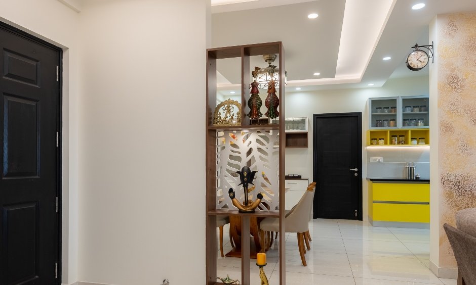 Foyer with a wooden partition in Bengaluru that showcases your favourite home decor elements