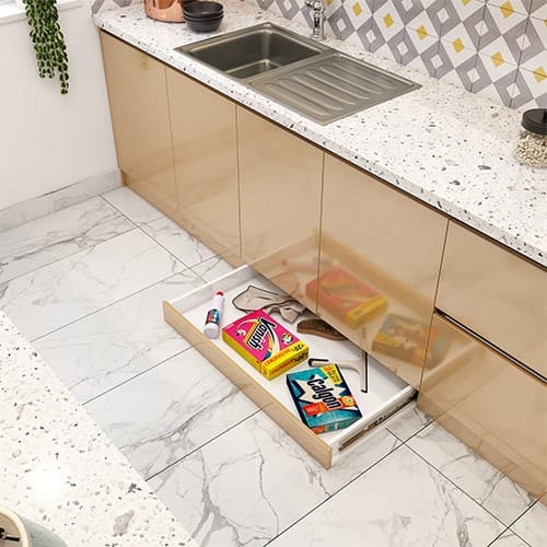 Home interior designer in Kolkata created a skirting drawer that utilizes the dead space