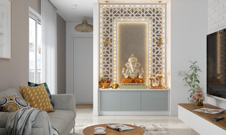Home mandir with white and grey jaali design creating a serene and sacred prayer space