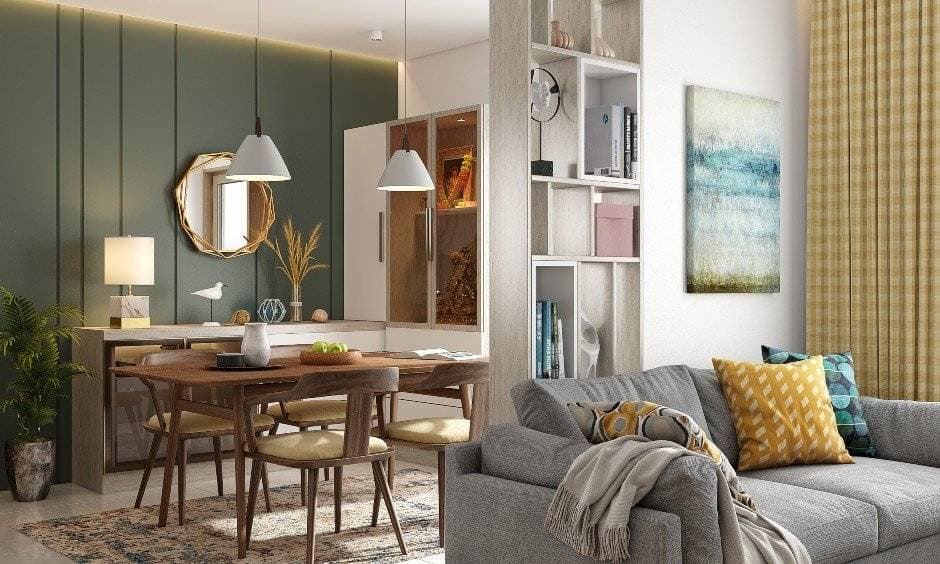 Grey wainscoting accent wall breaks the monotony of the muted colours elegantly in house design 2bhk