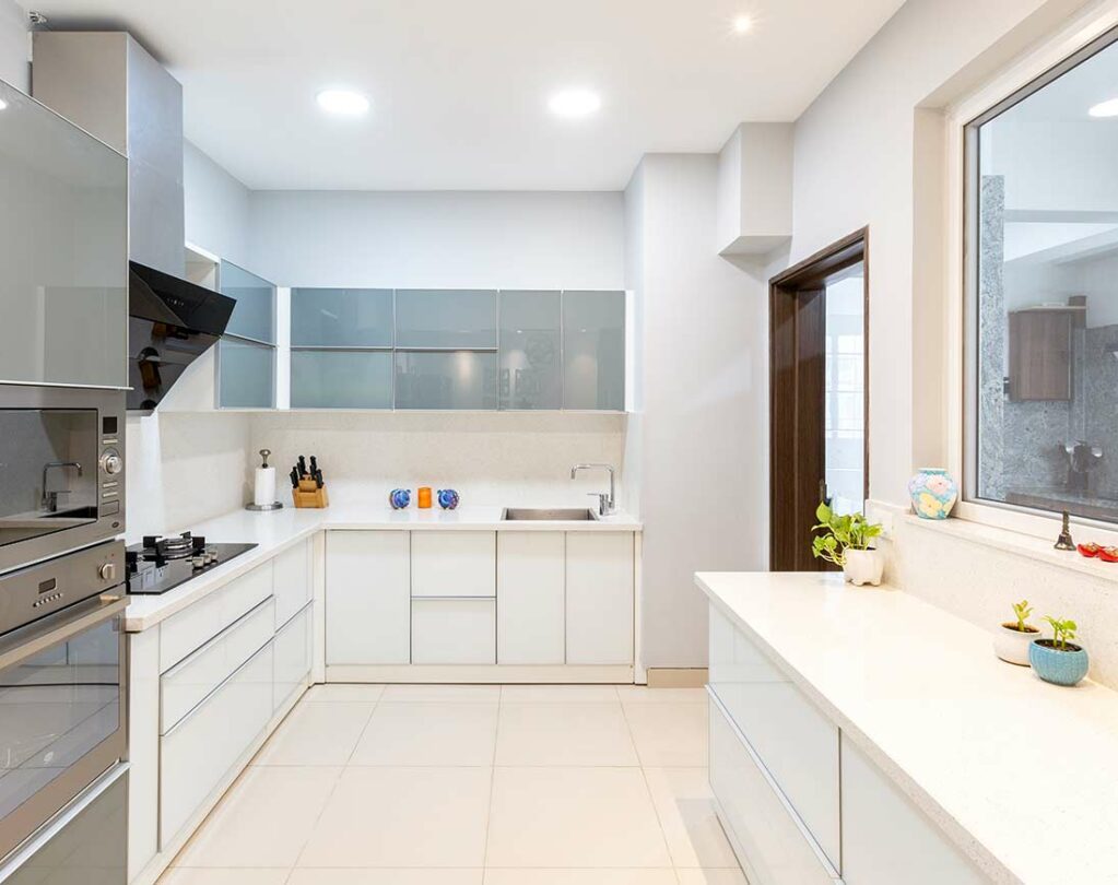 Grey and White u shaped kitchen designed by one of the best interior firms in bangalore