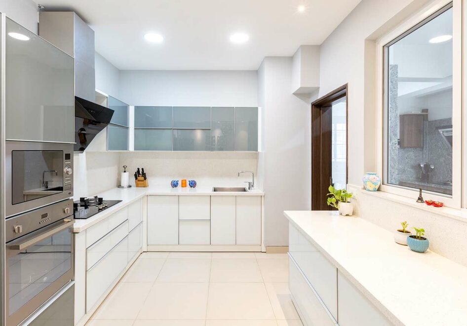 Grey and White u shaped kitchen designed by one of the best interior firms in bangalore