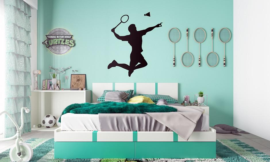 Playful kids bedroom wallpaper and decals create an accent wall featuring a badminton theme.