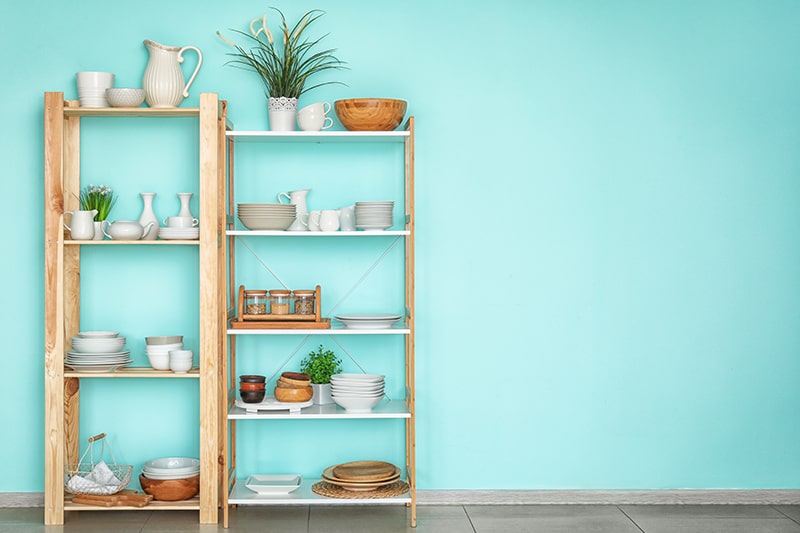 Free stand kitchen storage racks are placed next to each other to produce unique modular kitchen storage