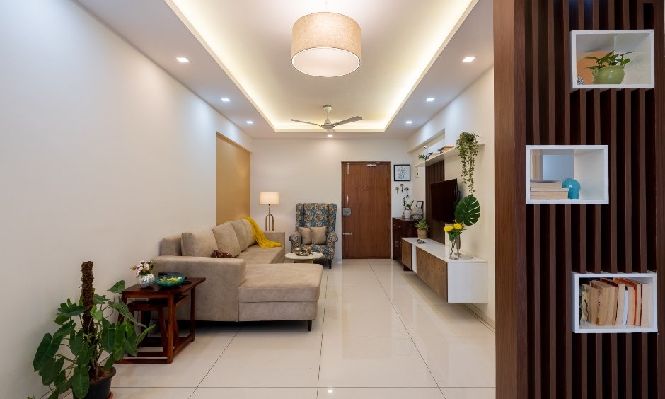 Open living room with a wooden partition design in Tejaswini Nagar, Bengaluru