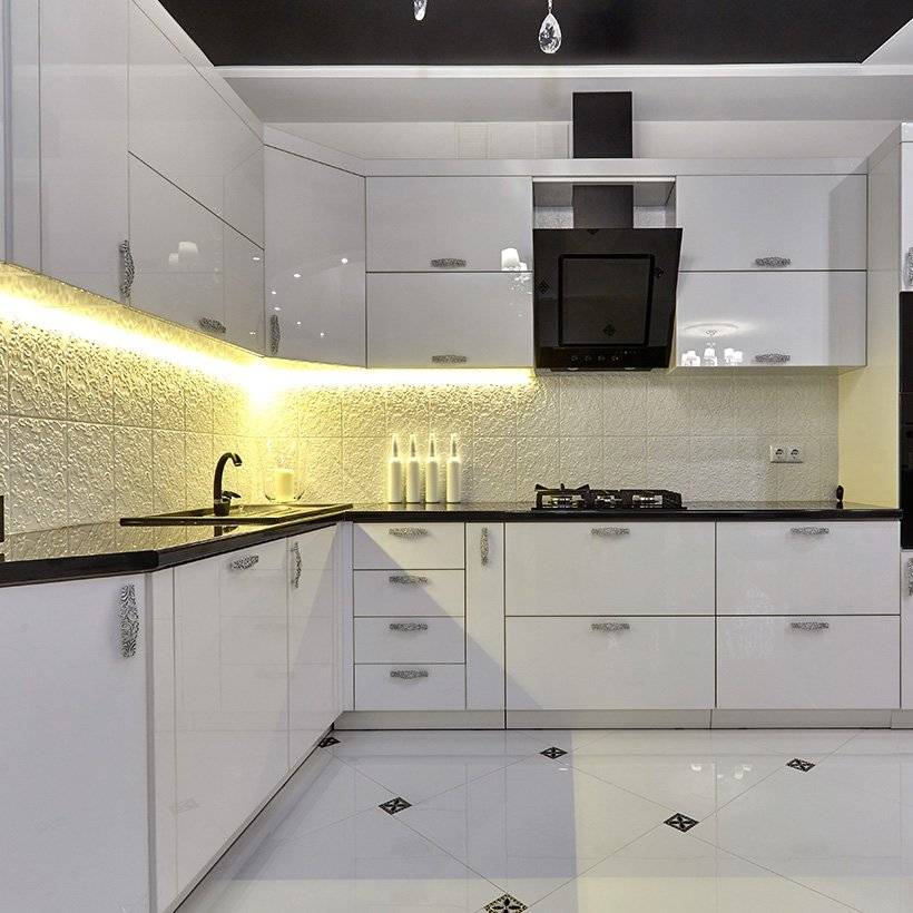 Modern kitchen cabinets with glossy white finish in l-shaped kitchen