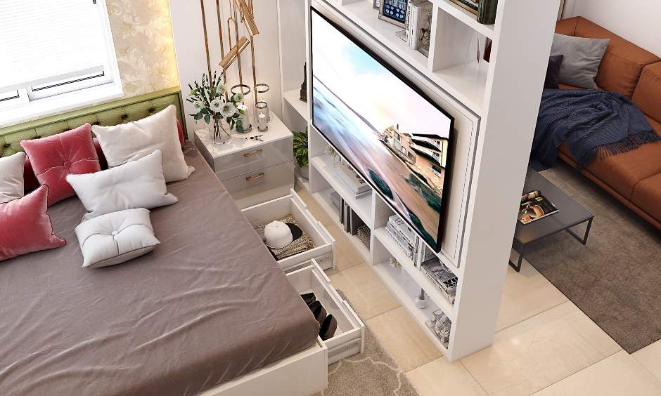 A modern living room cum bedroom with storage beneath the bed