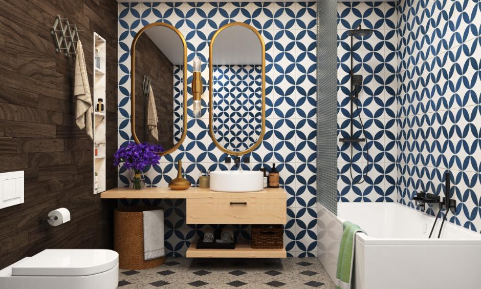 Moroccan bathroom design with mosaic tiles, arched mirror, and golden fixtures
