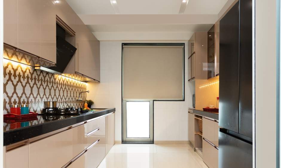 3 bhk parallel kitchen with glossy laminate cabinets and appliance garage in Powai, Mumbai.