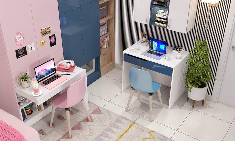 Pink kids wardrobe with a pull-out study table and pink chair for comfortable study time