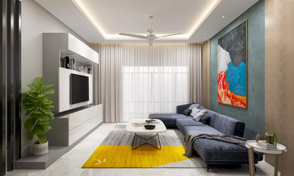 The living room is designed with a sectional sofa and an entertainment unit in a 2bhk interior with multiple storage units