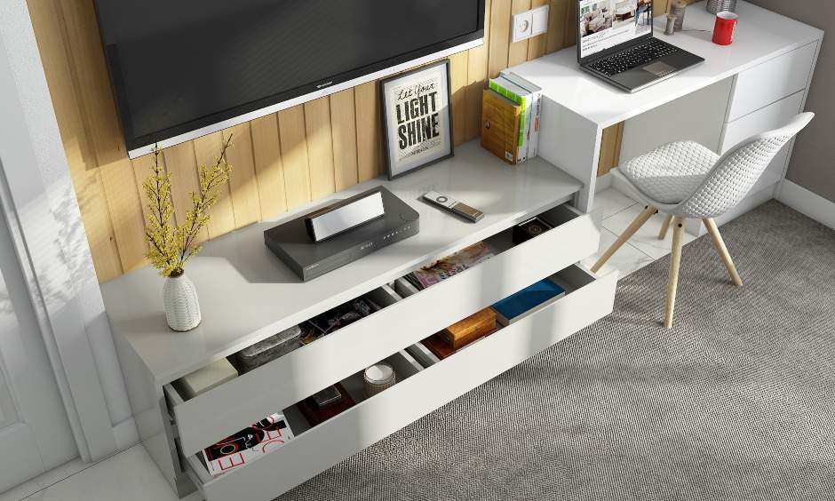 The small home office design features a white laminate-finish work desk unit with a chest of drawers