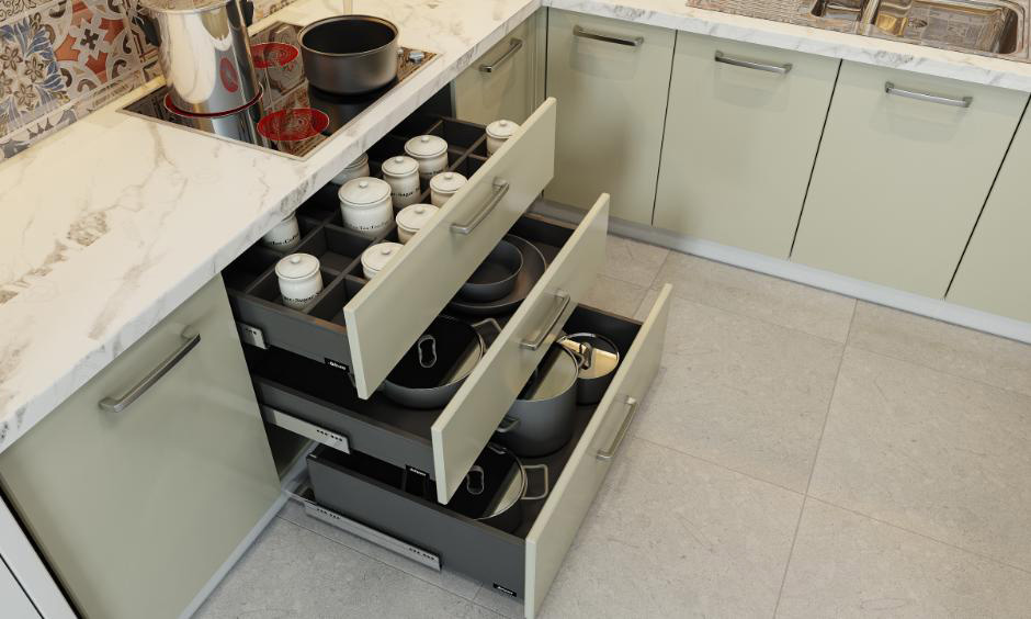 Tandem box holding labelled pantry goods; adjacent wire basket with onions, potatoes, and dishes.