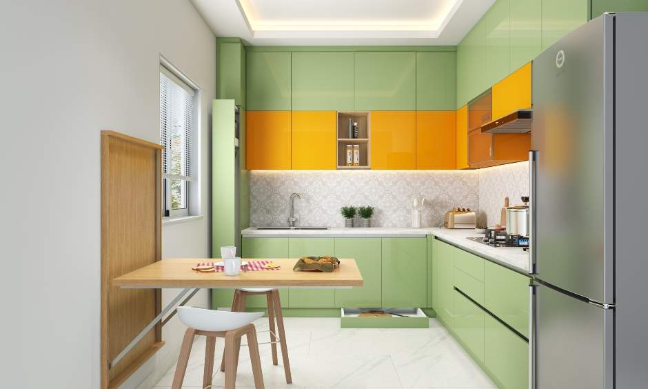 Space-saving green kitchen with wall-mounted foldable wooden dining table for two