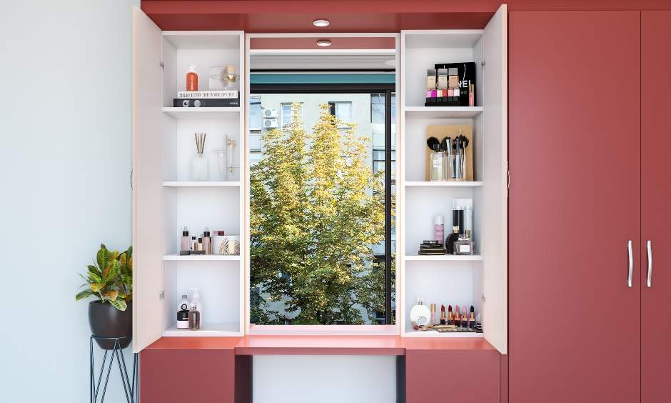 Wardrobe with dressing table has a mirror and shelves for accessories on either side